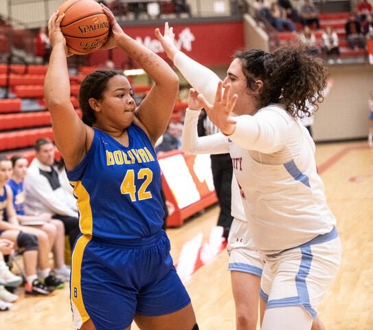 Lady Liberator Dailynn VanDeren draws the Lady Cardinal defense away from the basket.   STAFF PHOTO/BOB CAMPBELL