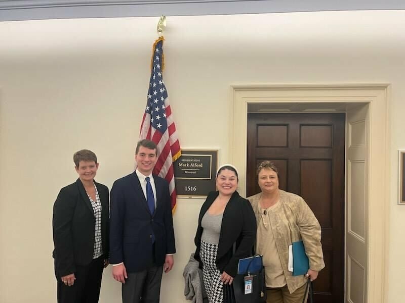 Michelle Morris (far left) visits with legislative and health officials next to Representative Mark Alford's office at the Capitol in Washington D.C.