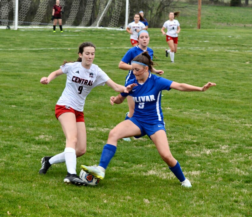 Sophomore Ellen Garber fights for control against a Central Bulldog early in the first half of the game on Tuesday, April 4.   STAFF PHOTO/QUINCY YOUNG