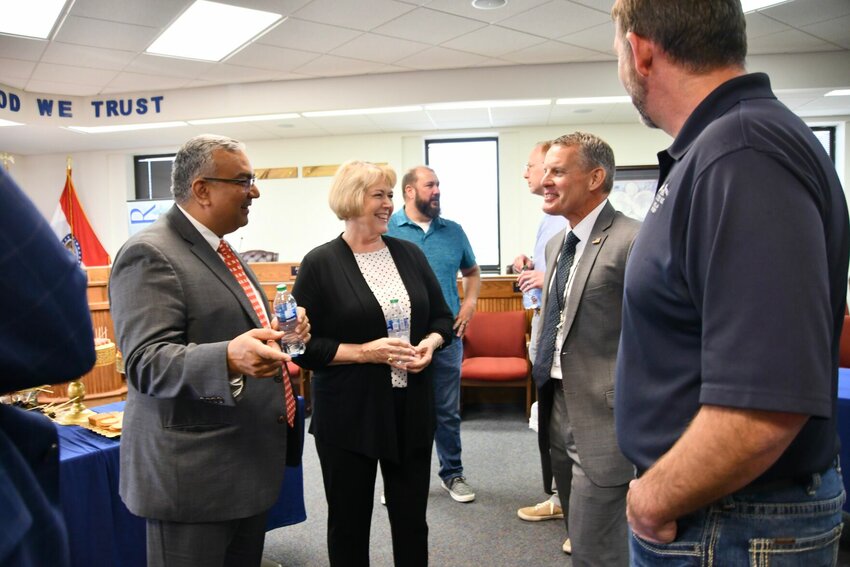 Missouri State Treasurer Vivek Malek and Missouri First Lady Teresa Parson visit with Relford and Mayor Chris Warwick.
