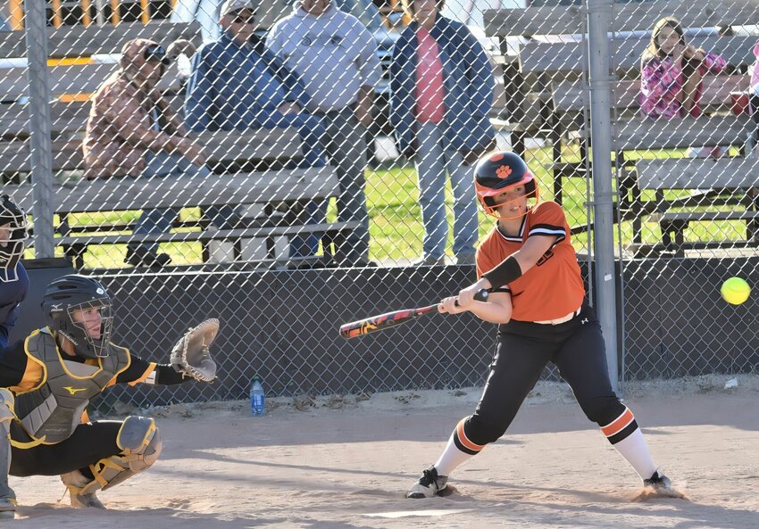 Up to bat in the Friday, April 21 game, #9 Kayci Payne from Humansville in the bottom of the third inning as Pleasant Hope&rsquo;s catcher #10 senior Rebeckah Webb waits for the ball. Pleasant Hope over Humansville 18-2.   STAFF PHOTO/MIKE KOOTZ