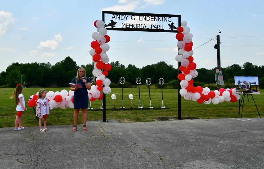 Abby Glendenning, joined by her daughters Ellie and Mila, welcomes the community to the groundbreaking of the Andy Glendenning Memorial Park at the Bolivar Municipal Airport on Friday, June 2.