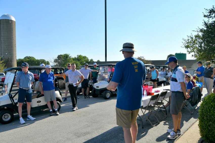 Brett Potts, left and Brady Vestal welcome the teams to the Doug Potts/Bolivar Educational Advancement Foundation Golf Classic on a beautiful summer morning, Monday, July 10.   STAFF PHOTO/LINDA SIMMONS