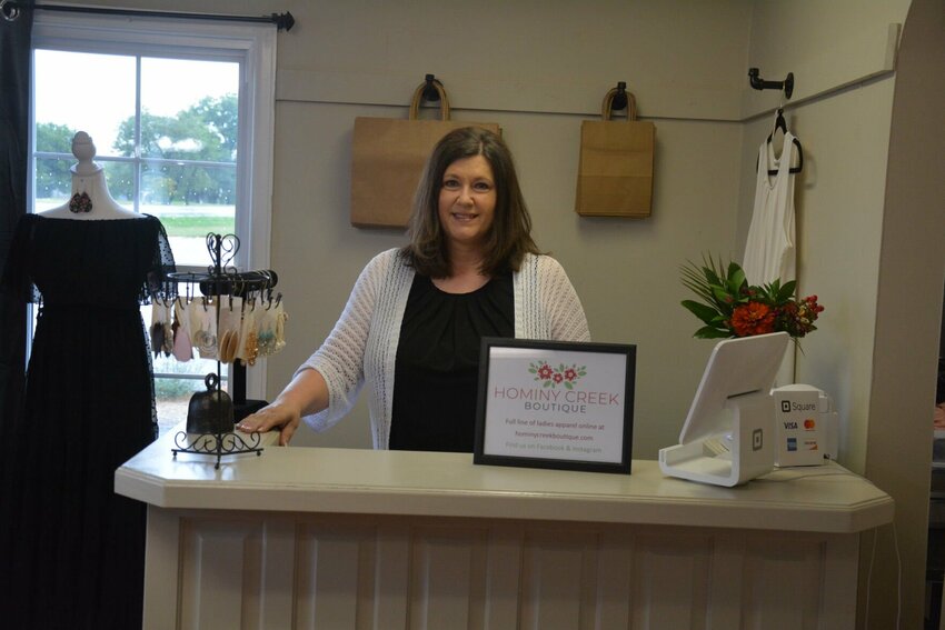Lisa Barham manages the front desk at her new Bolivar store, Hominy Creek Boutique.
