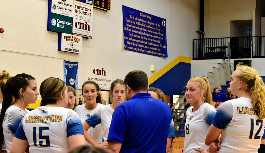 Head Coach Kyle Smith has the attention of the Lady Liberators during the game Tuesday, Aug. 29.   STAFF PHOTO/MIKE KOOTZ