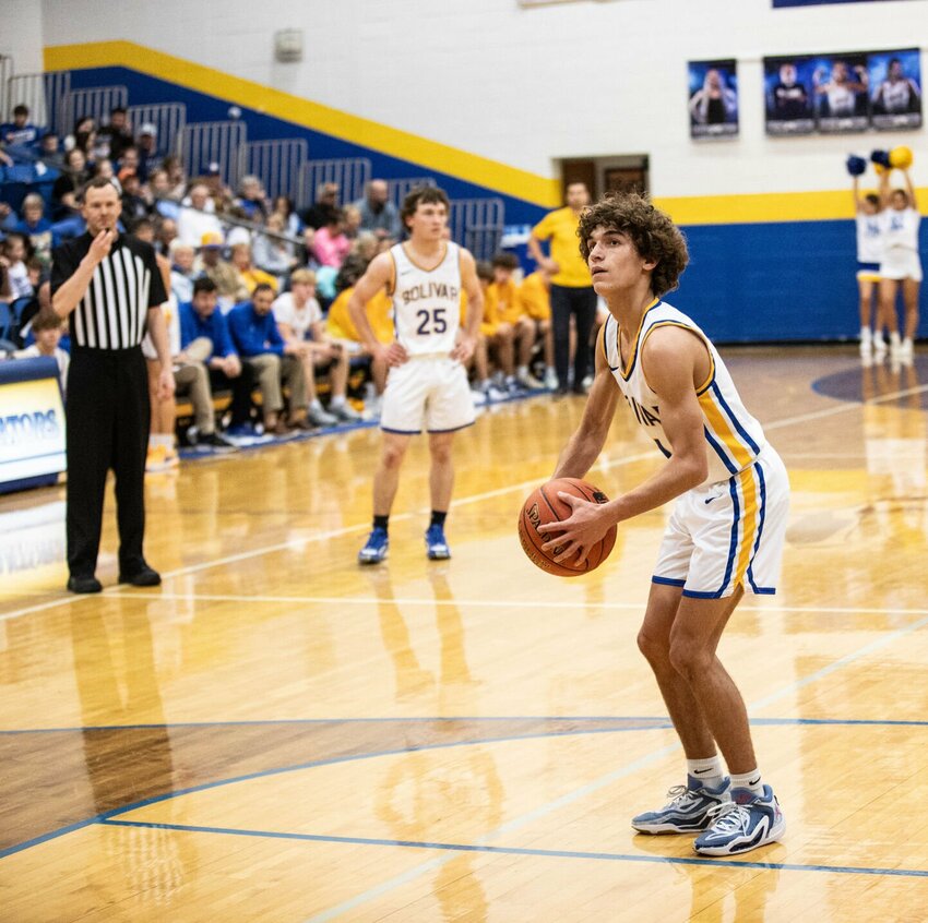 Liberator point guard Damean Young eyes a free throw.   STAFF PHOTO/BOB CAMPBELL
