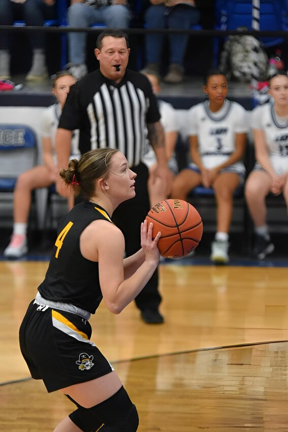 #4 Senior Graci Wolf shoots a free throw after being fouled by a Morrisville player. Morrisville won the contest 63-21 at the Morrisville tournament.   STAFF PHOTO/MIKE KOOTZ