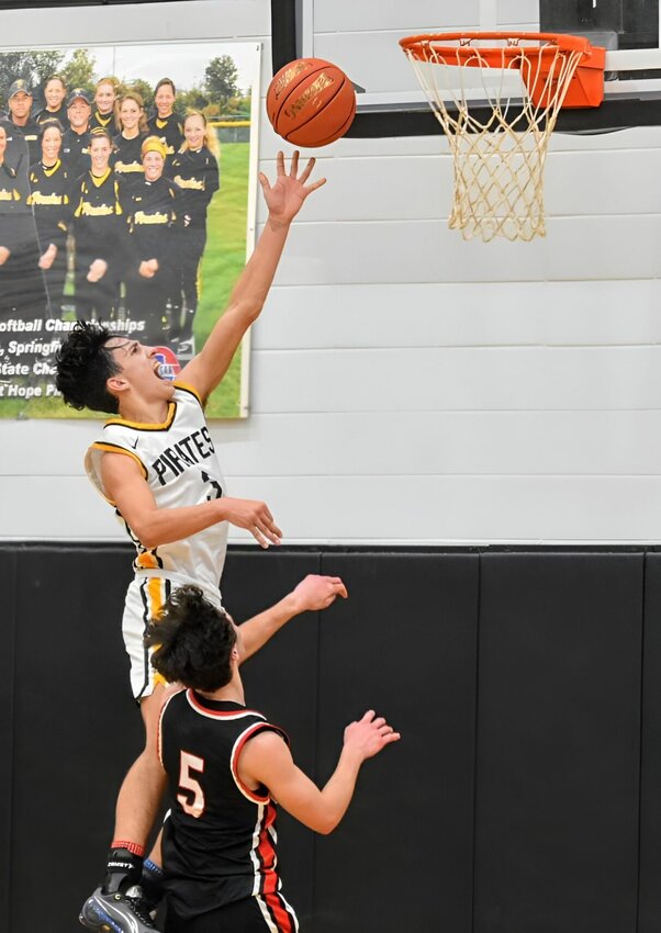 Pleasant Hopes #3 Senior Ryder LaBee steals the ball and goes in for the layup. Pleasant Hope came away with the win over Stockton 68-61.   STAFF PHOTO/MIKE KOOTZ