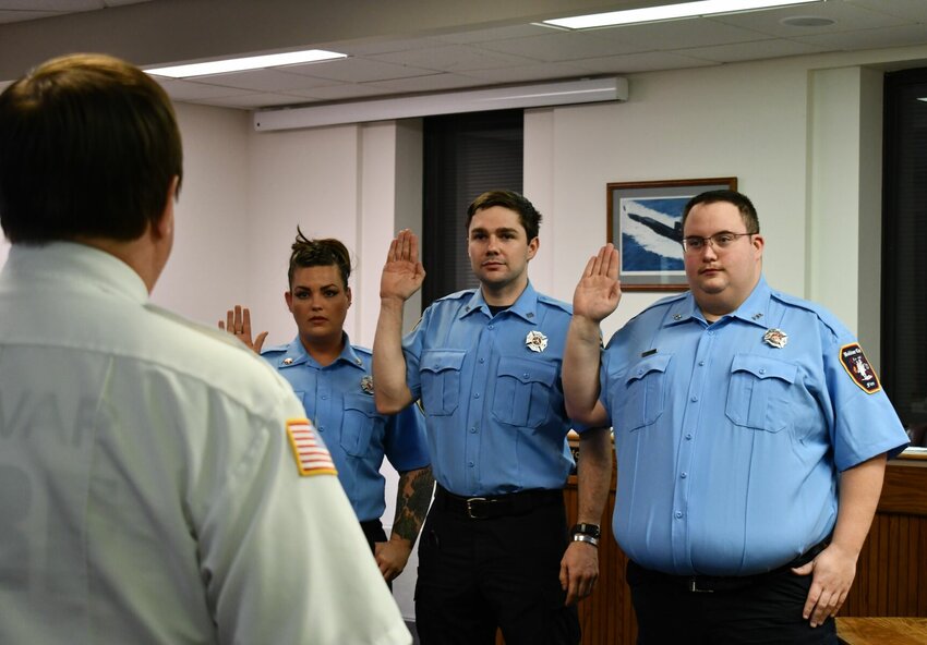 Chief Brent Watkins swears in three new Bolivar City firefighters. Pictured are, from left, firefighters Falecia Watson, Isaiah Prewitt and Tommy Gerean.   CONTRIBUTED PHOTO