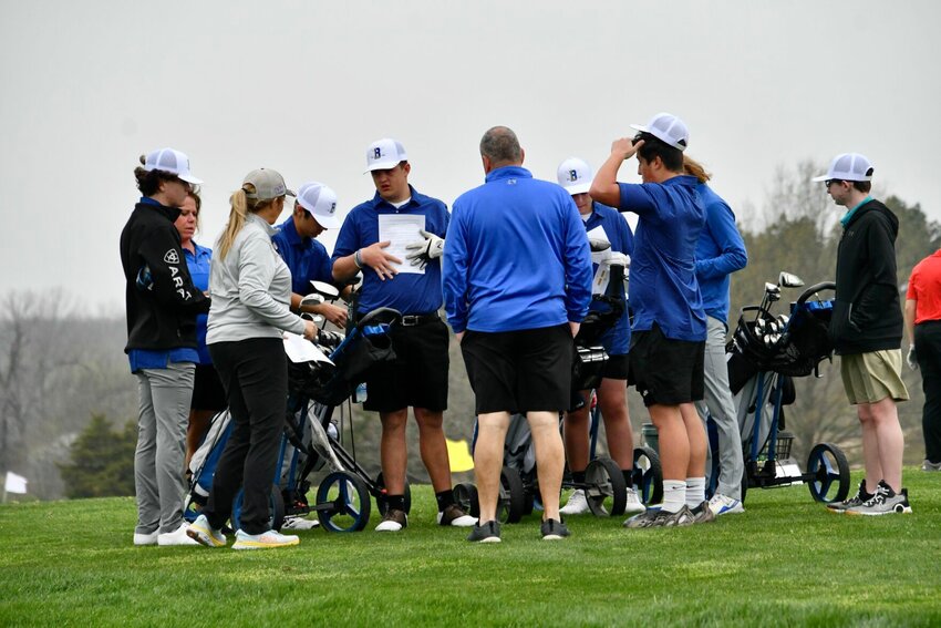 Coach Holt with the team for a last minute pep talk.   STAFF PHOTO/LINDA SIMMONS