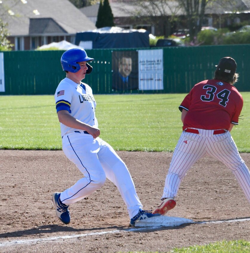 Kanyon Degraffenreid makes it back to second base ahead of a Buffalo Bison in the April 5 game. STAFF PHOTO/LINDA SIMMONS