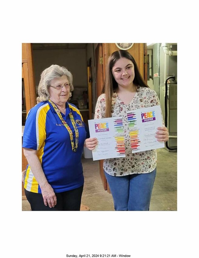 Mary Ann Brazzell receiving district recognition from Rosalie Watts, District International Peace Poster Chair Person.&emsp;CONTRBUTED PHOTO