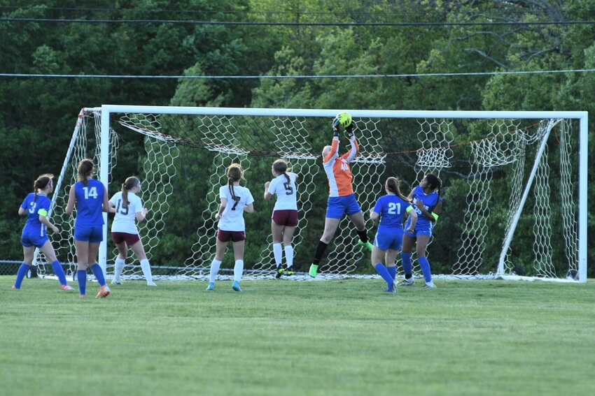 Bolivar goalkeeper Aby Kaufmann goes up for a save on an Osage free kick. Kaufmann had five saves on the night.
