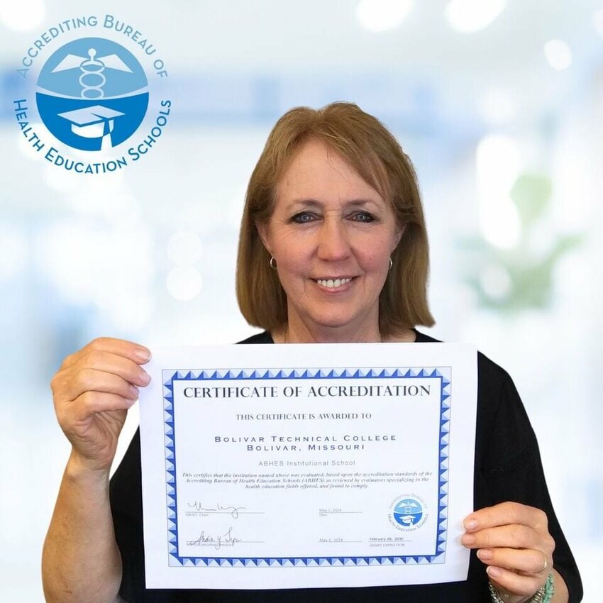 Charlotte Gray, President at BTC, presenting the Certificate of Accreditation from ABHES.   CONTRIBUTED PHOTO