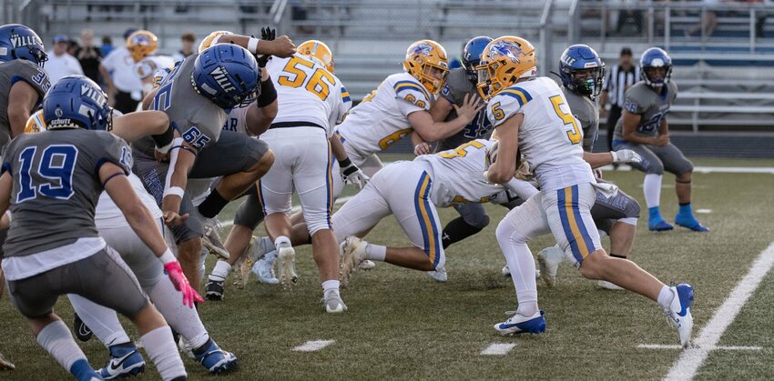 Gardner Casey #5, takes advantage of a great block by his line.


STAFF PHOTO/BOB CAMPBELL