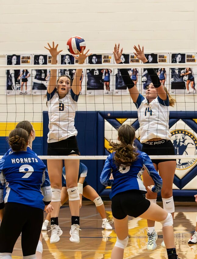 #9 Skyla Moore and #14 Megan Howard defend the net.   STAFF PHOTOS/BOB CAMPBELL