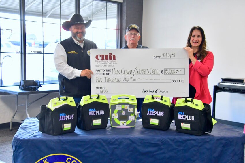 Christina Bravado with CMH Board of Directors presents a check to Sheriff Danny Morrison and Emergency Management Director Rick Davis.


STAFF PHOTOS/LINDA SIMMONS