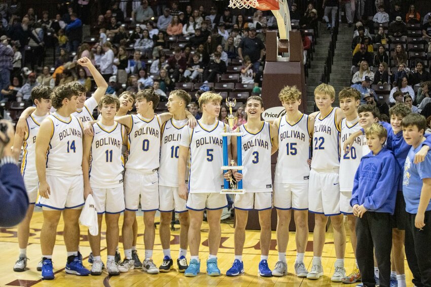 Liberators with the 2nd place trophy in the Blue and Gold, a testament to overcoming obstacles all week with teamwork, grit and love for the game.