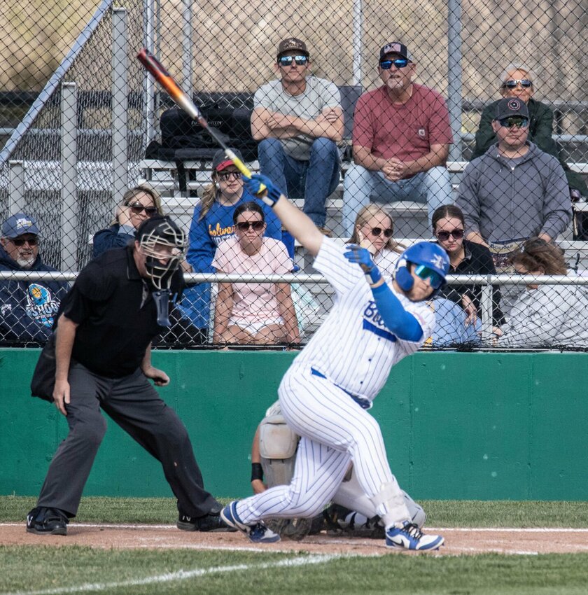Garret Cook drives the ball with a big swing.   STAFF PHOTO/BOB CAMPBELL