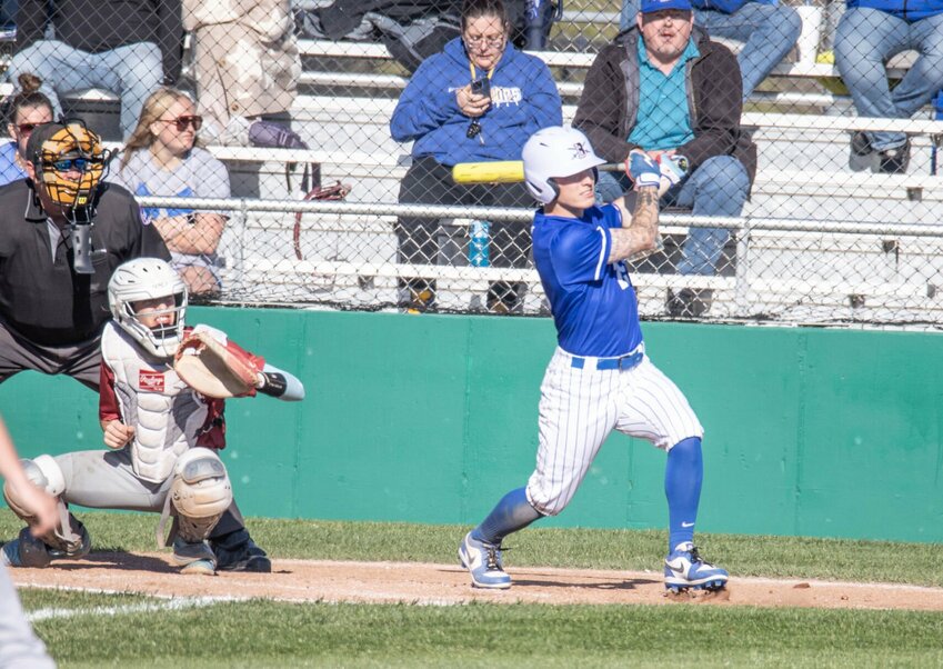 Kanton Fisher sends one to the outfield.   STAFF PHOTOS/BOB CAMPBELL