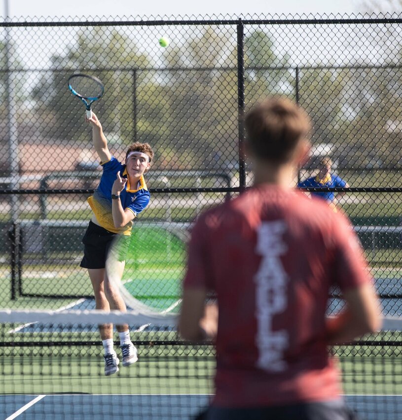 Cy Douglas serves to a Nixa Eagle.
