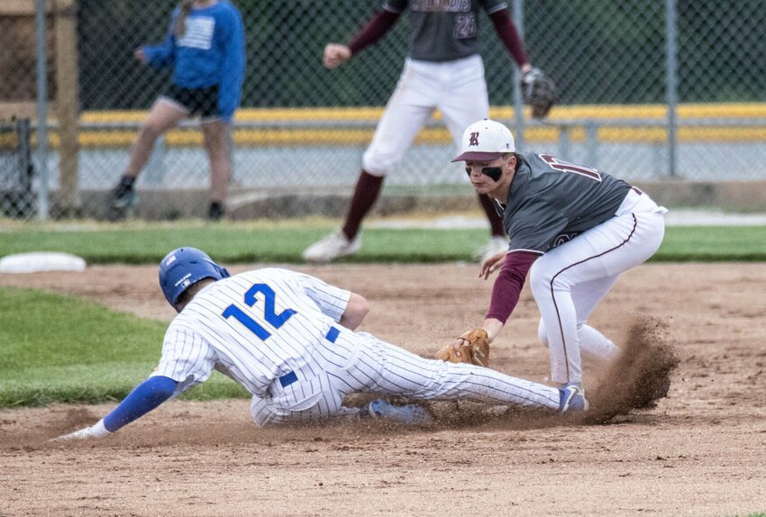 Evan Mortensen steals second.   STAFF PHOTOS/BOB CAMPBELL