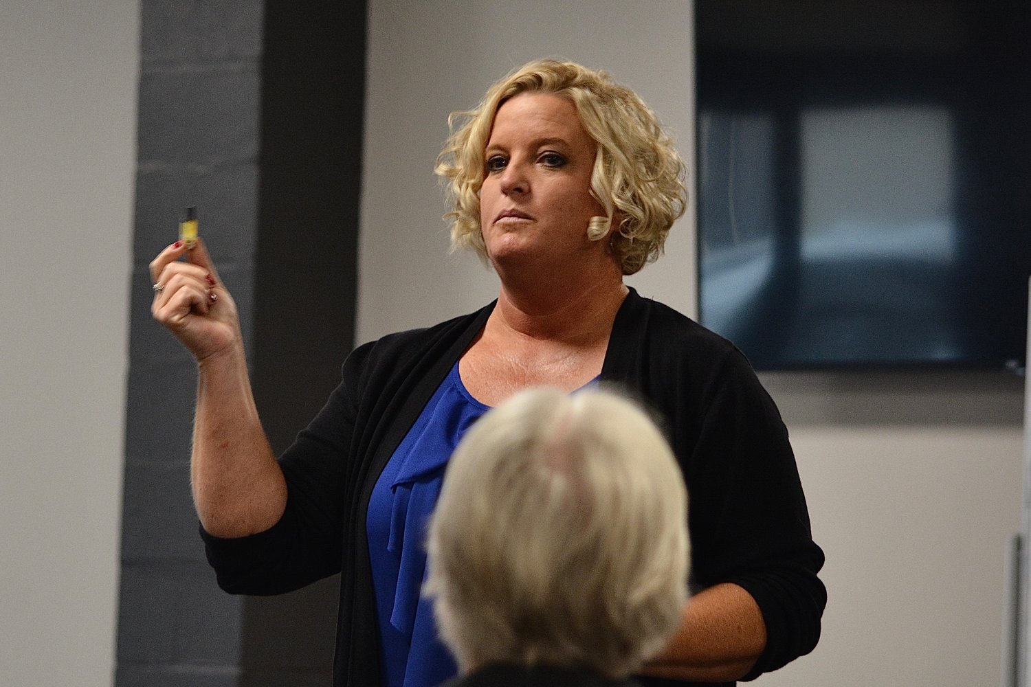 Humansville superintendent Tammy Erwin holds up the cartridge of one of the vapes confiscated from students in her school district.