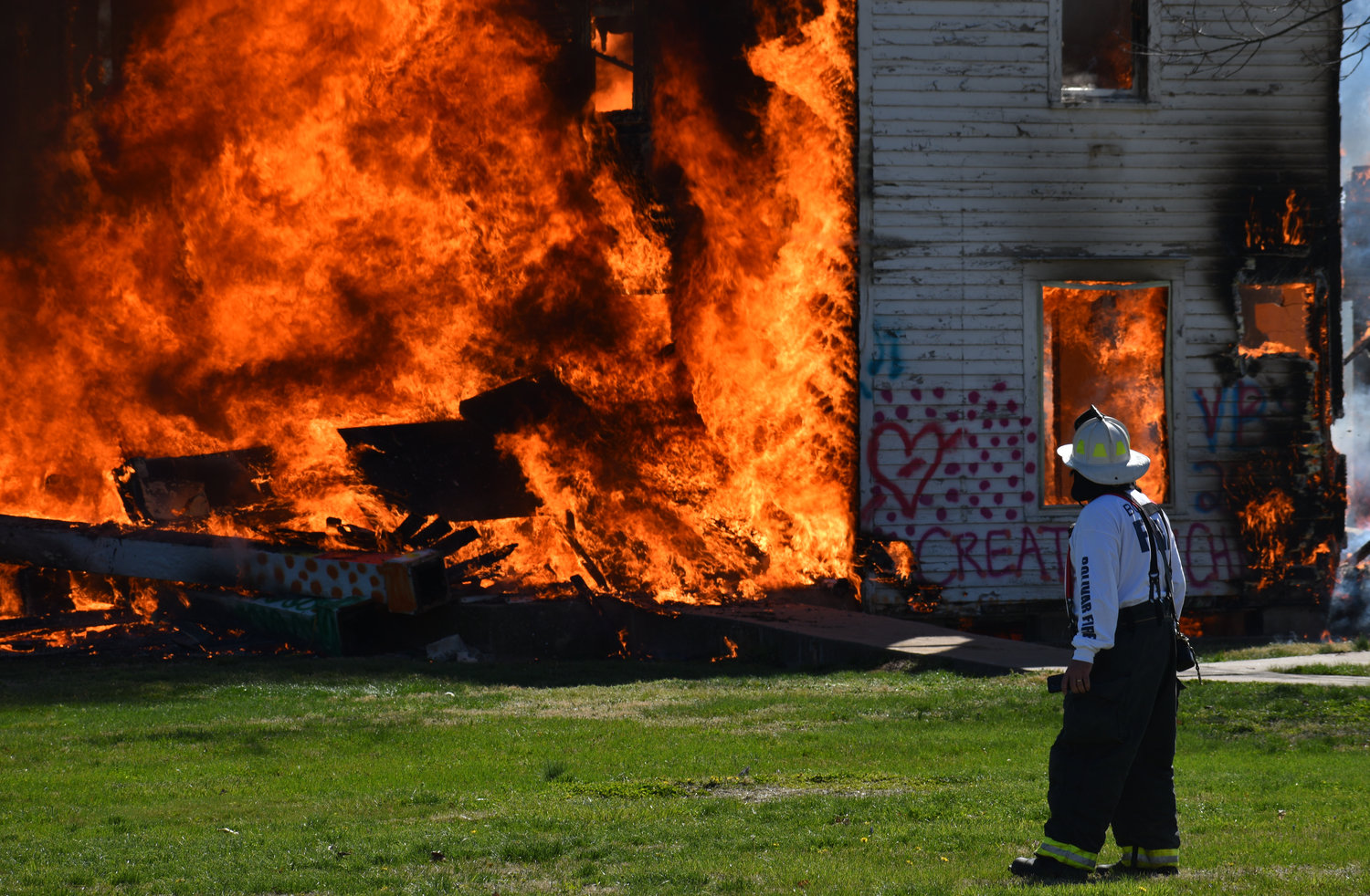 Bolivar City Fire Chief Brent Watkins watches intently as the White House burns during a controlled fire training Saturday, April 9.