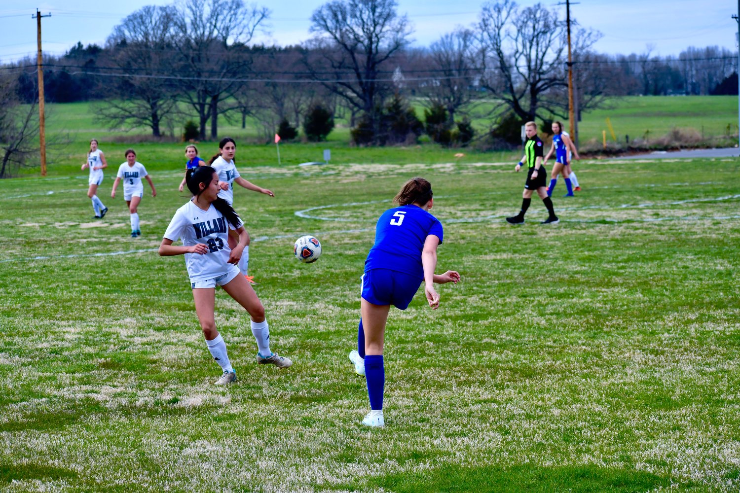 Ellen Garber threads the needle in a pass to London Wilson.