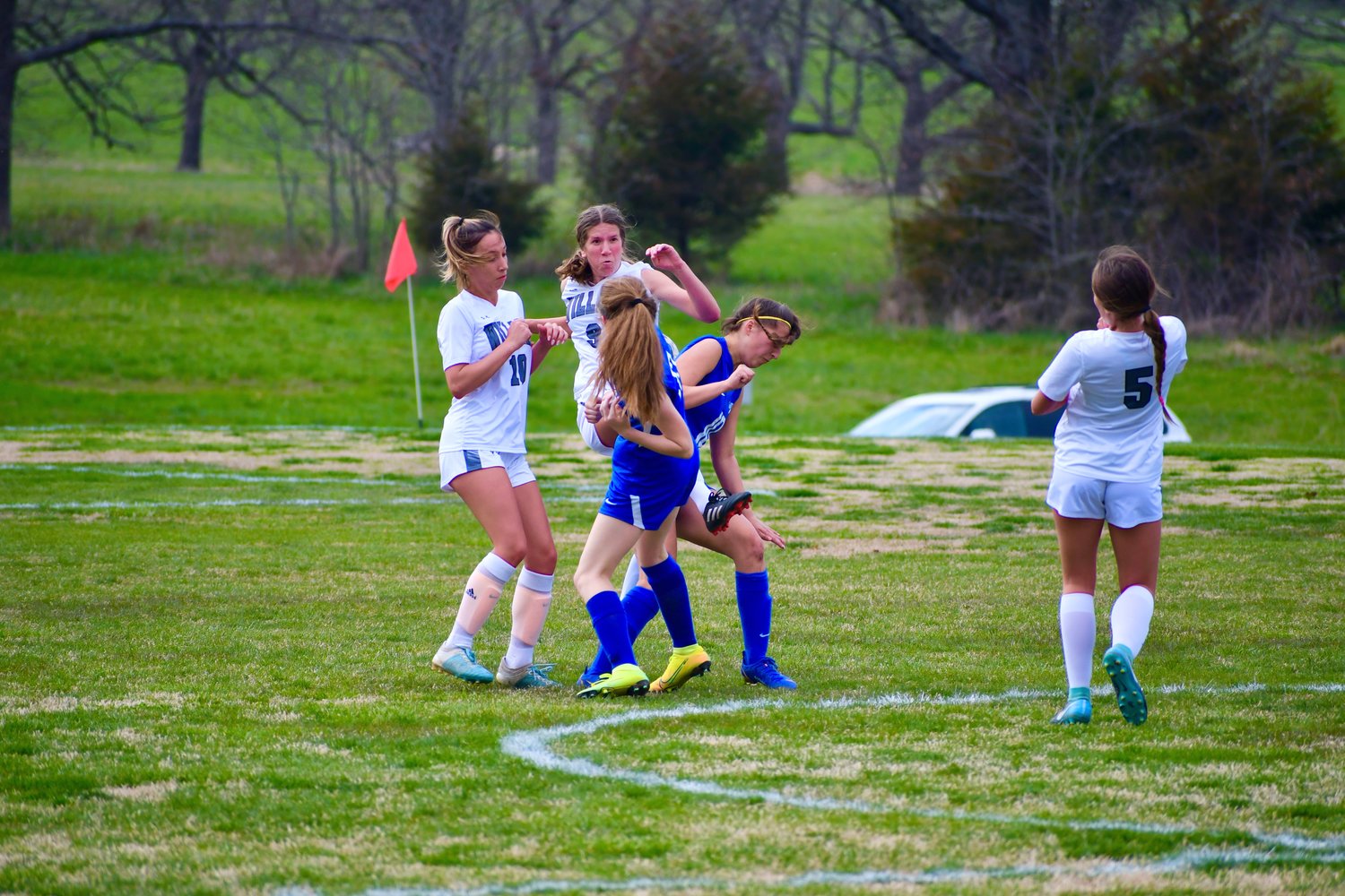 Stella Scowden and Claire Giglio fight through kicks for the ball.
