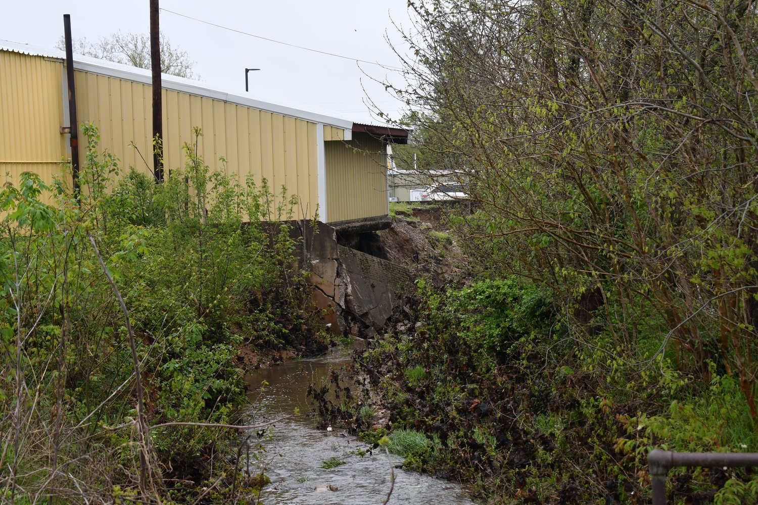 Sho-Me Muffler and Brake on West Broadway Street in Bolivar lost a large portion of the retaining wall at the back of their building following heavy rains this week.