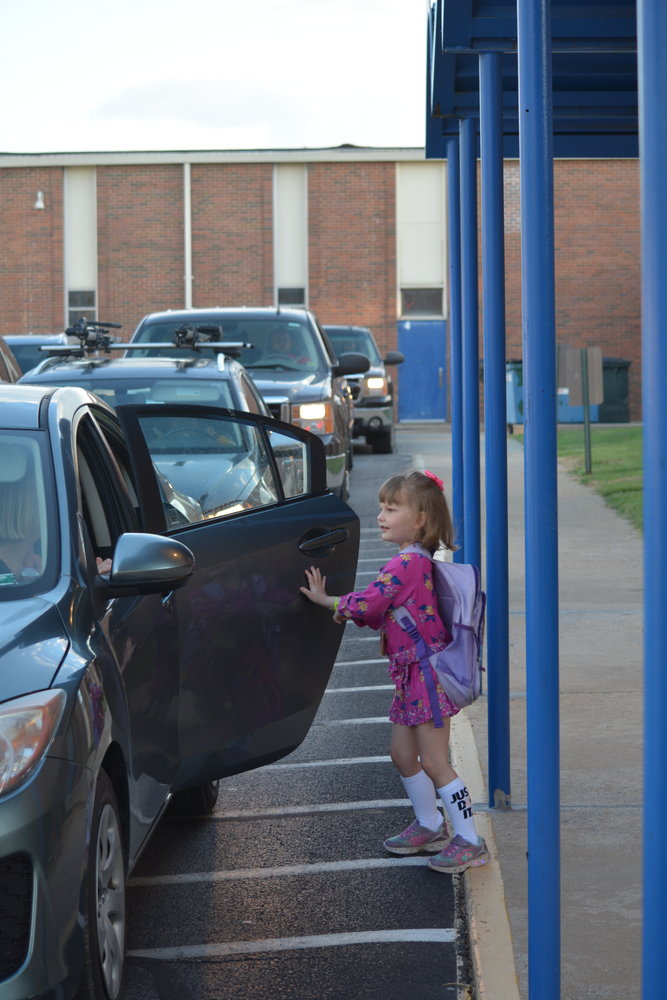 Students at Bolivar Primary School waved good-bye to their parents and stepped out of school buses to start their first day of kindergarten, first, and second grades.
