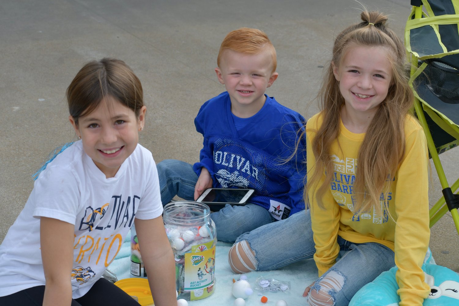 Harper Rice, Beckett McMillen and Blakely McMillen loved the cool weather and were ready to show their Liberators some love at the parade on Friday, Oct. 7.
