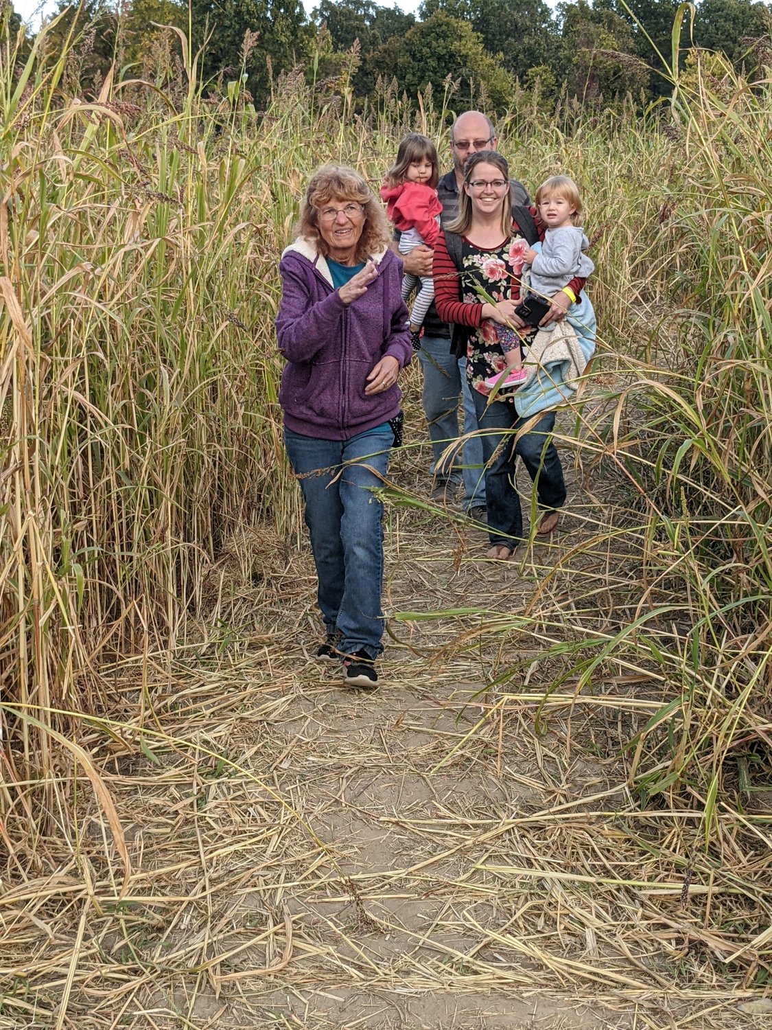 Duane Tillery and the Tait family return from an exciting trip through the corn maze at Fieth Family Farm.