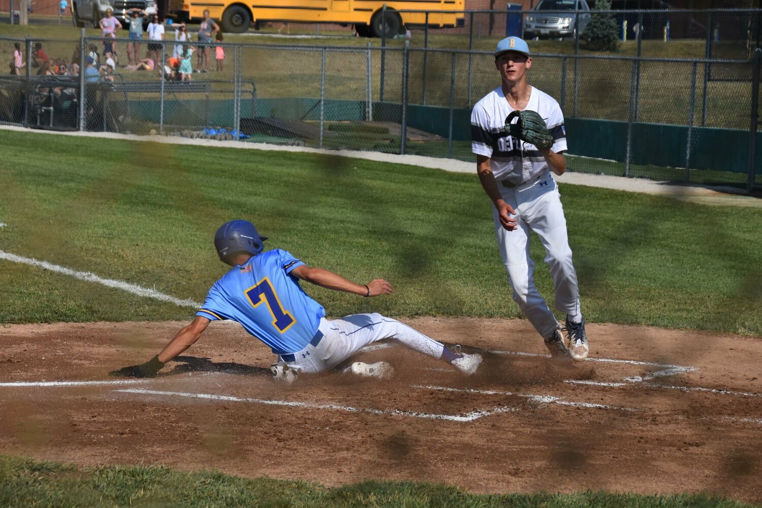 Mayfield slides into home, avoiding the defense.


STAFF PHOTO/AIDAN MAUCK