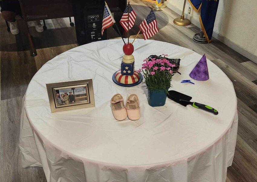Each item on the table symbolizes aspects of the life of the military child.