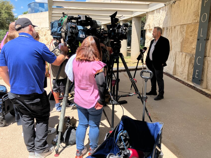 Lt. Terry Eoff answers questions about a murder and abduction at a press conference Aug. 27 at the Farmers Branch Justice Center.