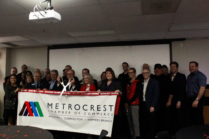 Dallas Medical Center Chief Executive Officer Ruben Garza cuts the ribbon to commemorate the DMC’s renovation of its cardiac catheterization laboratory on Feb. 27.