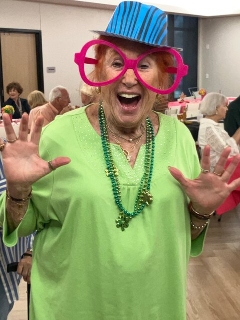 Candy Wedgewood dressed for a St. Patrick's Day party as well as Viva Fiesta, but was difficult to find in her green-screen photo.