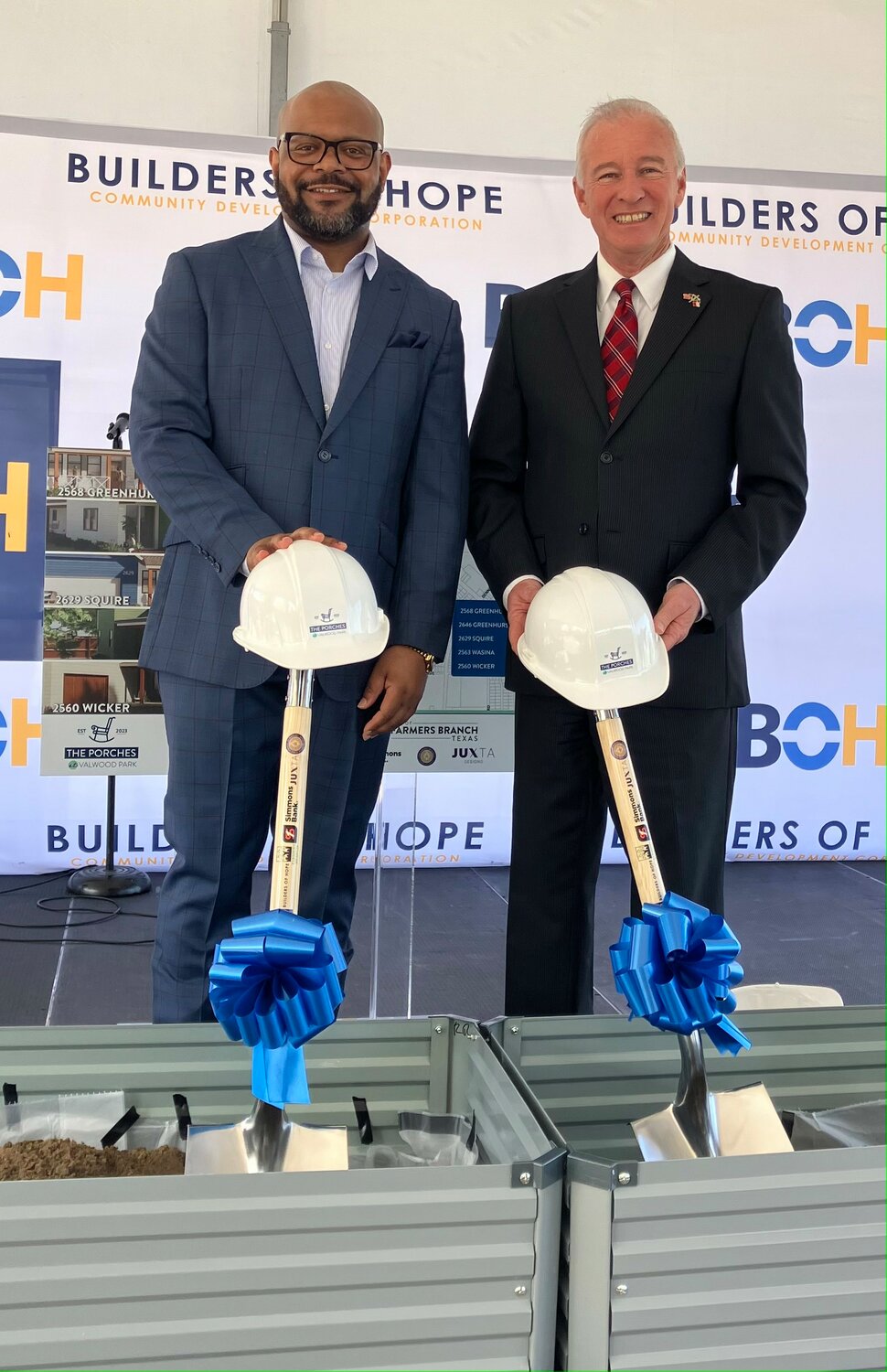 Builders of Hope President and CEO James Armstrong (left) and Mayor Terry Lynne celebrate a partnership with the city for the building of five homes through the city's Neighborhood Renaissance Program in March 2024.