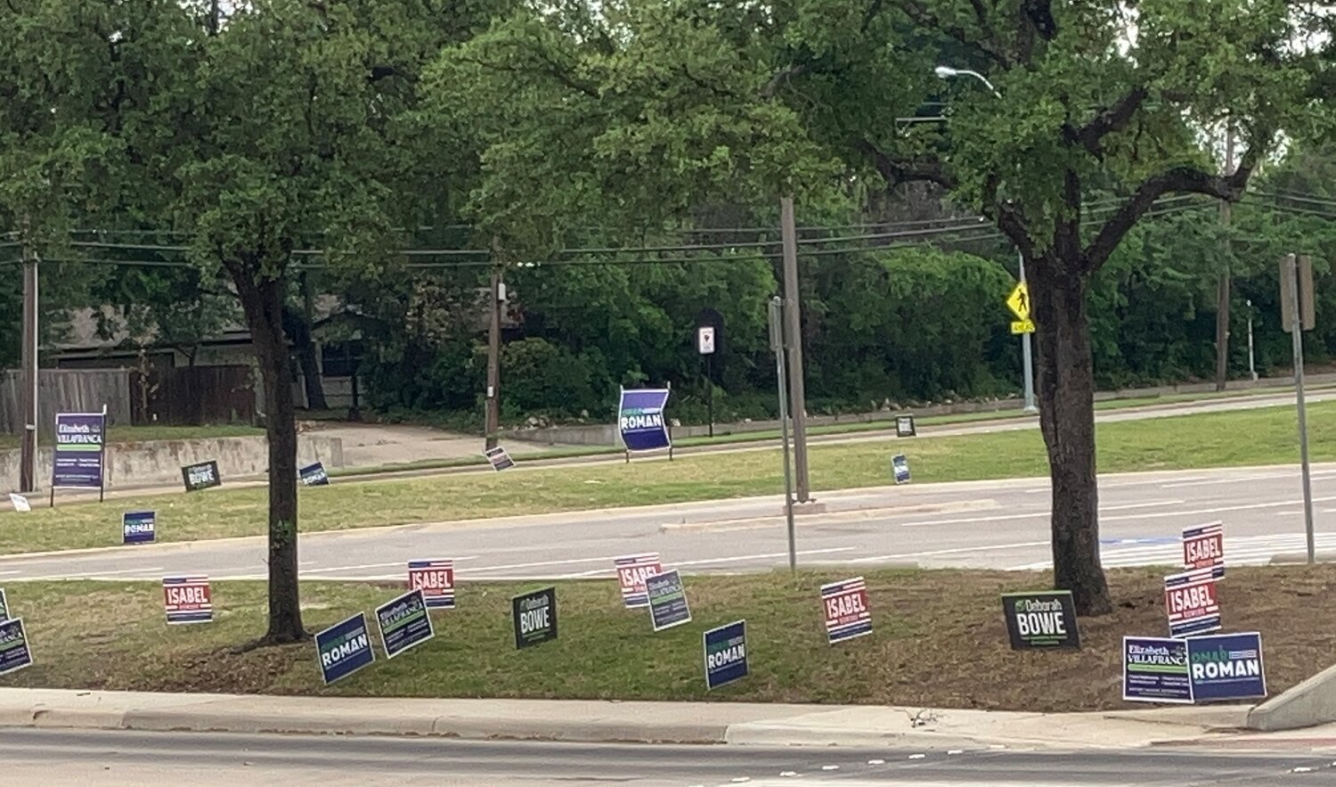 Election signs started popping up across from Farmers Branch Manske Library before the first day of early voting, April 22.