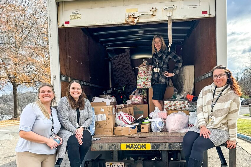Fauquier Health Team members help pack a truck with gifts for families in need.