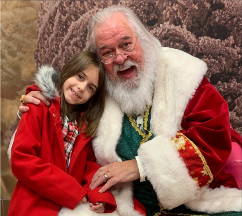 This Bristow girl was once afraid of Santa but warmed up to Santa Tom over some ice cream at Basking Robbins.