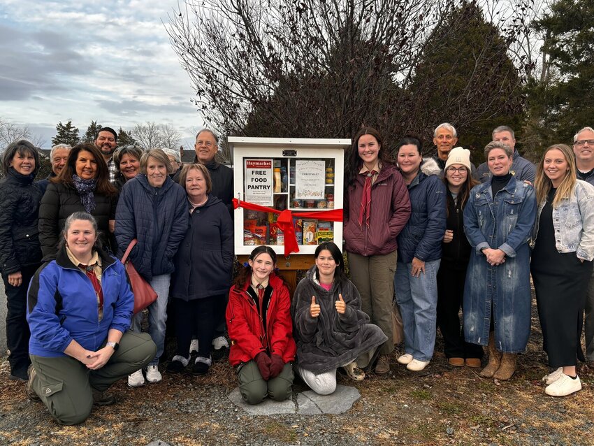 The Haymarket Town Council held a ribbon cutting for the Haymarket Free Little Food Pantry in cooperation with the Haymarket Baptist Church, Naomi Schneider and The Scouts of America Troop Girls Troop 924.