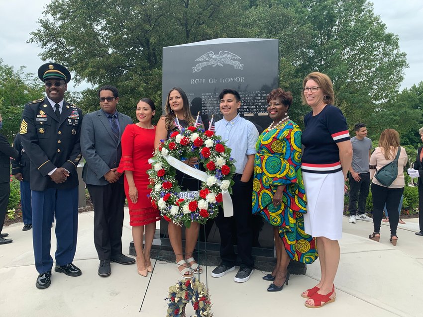 Prince William Supervisors honor deceased Army Reservist L. Eduardo Caraveo of Dumfries. Pictured: L-R Supervisors Victor Angry (Neabsco), Kenny Boddye (Occoquan), Yesli Vega (Coles); Angela Rivera, John Paul Caraveo; Supervisors Andrea Bailey (Potomac) and Jeanine Lawson (Brentsville).