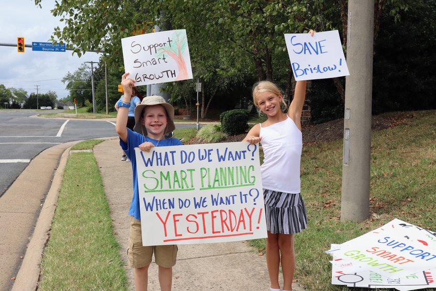 Gainesville mother and son protest the data centers. 