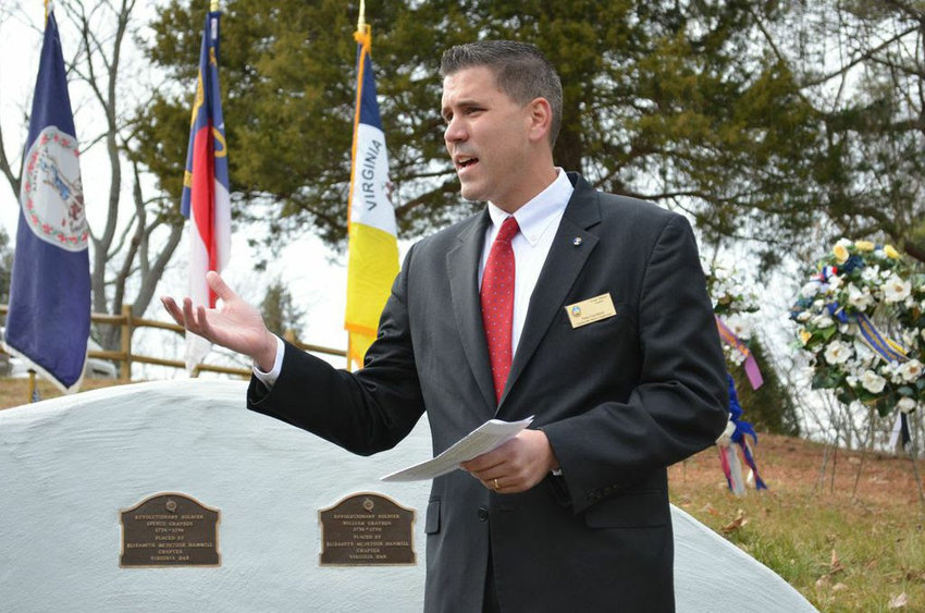 Gainesville Supervisor Pete Candland speaks at a memorial event.