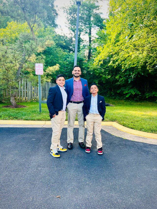 Rizwan Ishaq, owner of Peri Peri Original X Kallisto Steakhouse Bristow, with his two boys.