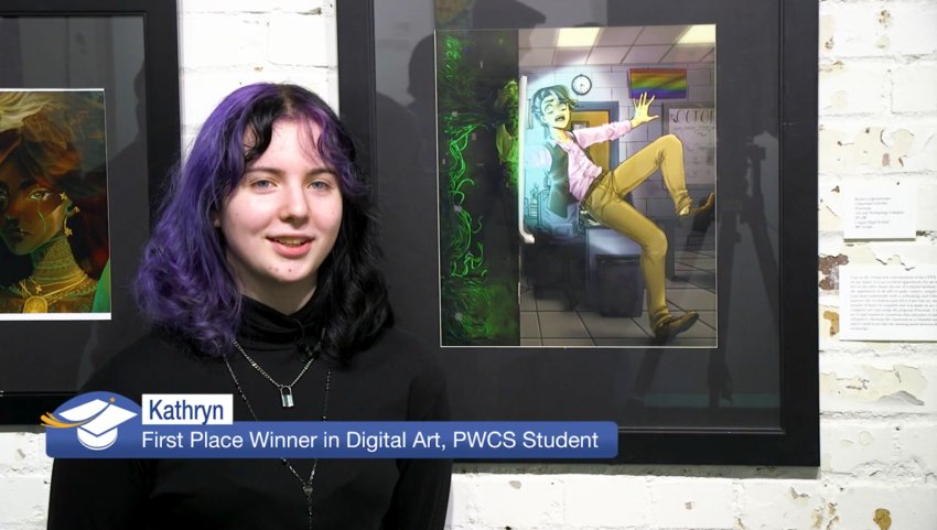 Kathryn, First Place Winner in Digital Art at the 19th Annual ARTFactory 'Off the Wall' student competition stands in front of one of her digital art pieces.
