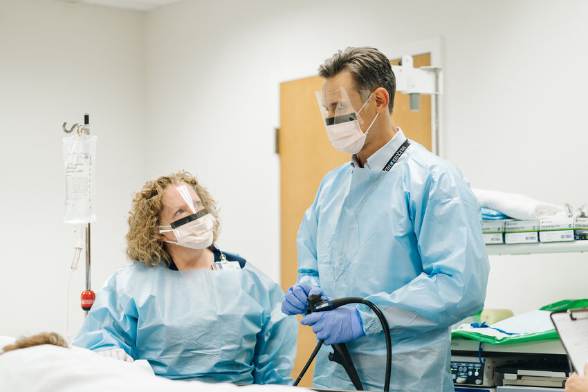 Dr. Harnden prepares the patient in the endoscopy suite at Fauquier Health.